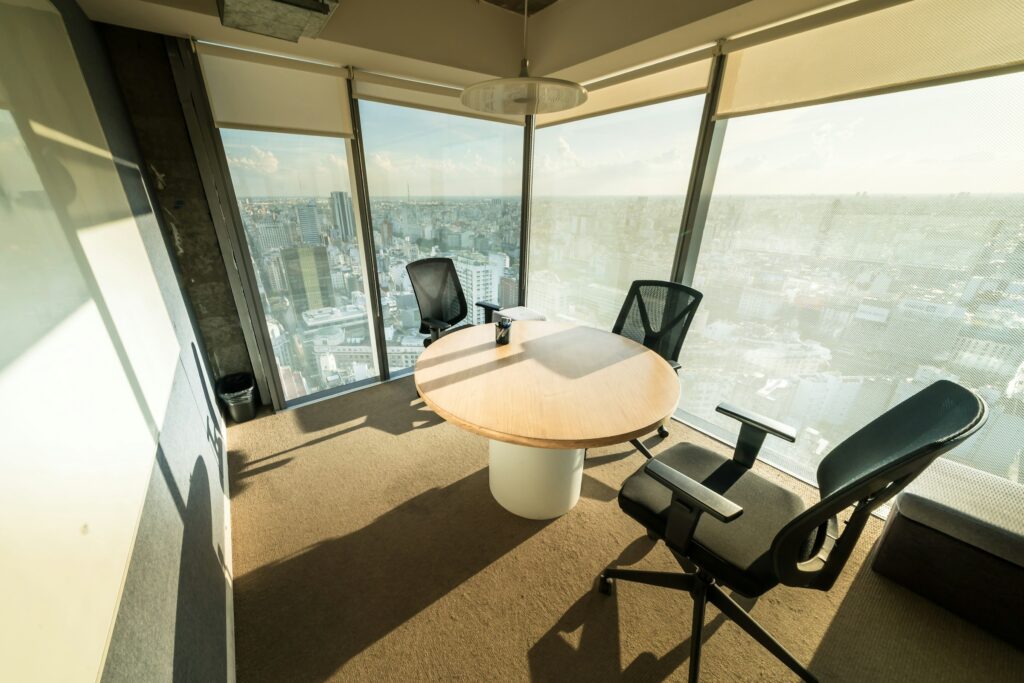Modern new-age office boardroom interior with city view, used to illustrate comparing office fit-out quotes and BOQ line items in India